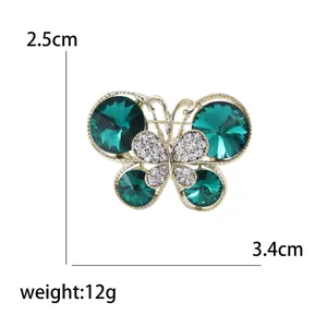 Broche papillon en cristal vert et métal doré avec strass, largeur de 3,4 cm