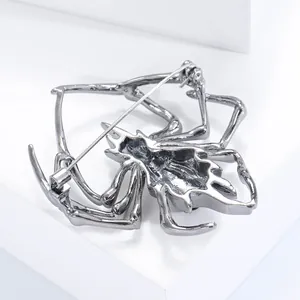 Detailed back view of spider brooch showing long pin and secure rotating clasp mechanism
