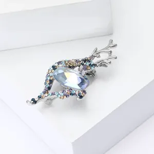 Elegant deer brooch with large blue crystal and colorful rhinestones on silver base