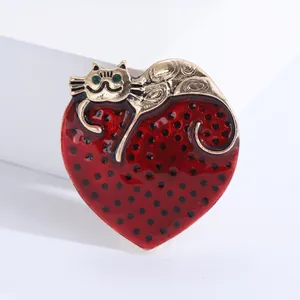 Cute cartoon heart cat brooch with red polka dots and golden feline detail in alloy