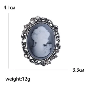 Vintage oval cameo brooch with crystal accents and white queen relief portrait