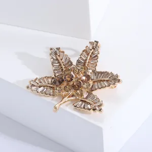 Baroque style golden maple leaf brooch with champagne crystals and brown gemstones