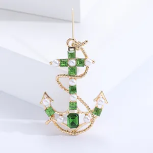 Elegant gold anchor brooch with emerald green gemstones and pearls for women