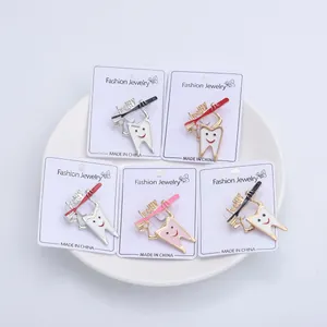Cartoon tooth and toothbrush enamel pins set on fashion jewelry display cards