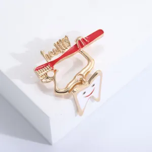 Detailed close-up of a creative red toothbrush and white enamel tooth lapel pin