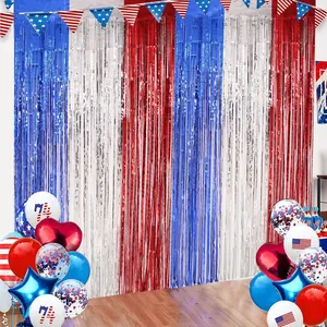 Independence Day red white and blue fringe curtain backdrop with star balloons and banners