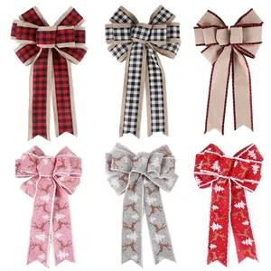 Set of six Christmas decorative bows in plaid and reindeer patterns for holiday party decor