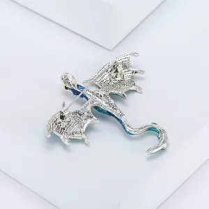 Detailed back view of the alloy dragon brooch showing the secure pin clasp and metal texture