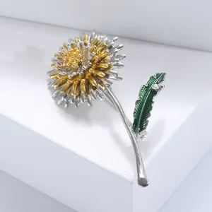 Broche tournesol élégante or et argent avec feuille émaillée verte et cristal brillant