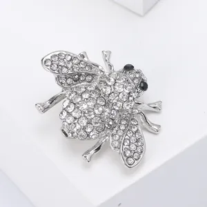 Elegant silver bee brooch with sparkling white rhinestones and black gem eyes for women