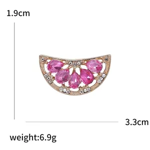Cute rhinestone watermelon brooch with pink gemstones and dimensions 3.3cm by 1.9cm