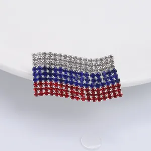 Macro detail of waving Russia flag brooch featuring vibrant white, blue and red rhinestones