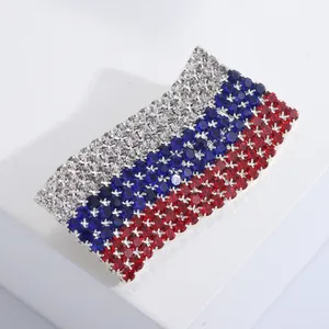 Macro shot of flag brooch with white blue and red crystals on silver finish base