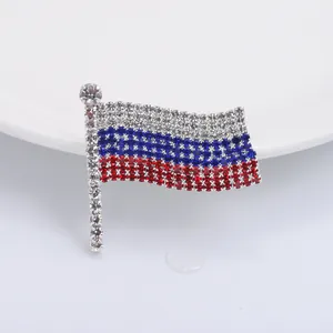 Detailed close-up of Russian flag rhinestone brooch with sparkling crystal finish