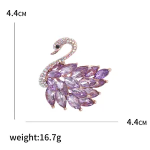 Elegant swan brooch with purple crystals and rhinestones, size 4.4cm x 4.4cm, 16.7g weight