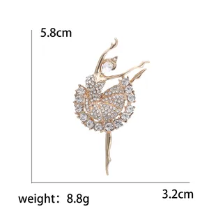 Sparkling ballerina dancer brooch in gold-tone alloy with white rhinestones and crystals