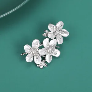 Elegant peach blossom brooch with white pearlescent petals and silver zircon inlay