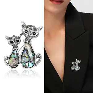 Retro cat brooch with iridescent abalone shell and sparkling rhinestones for suits