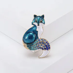 Detailed view of fox brooch with blue enamel and sparkling rhinestone gradient finish