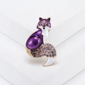 Detailed view of fox brooch with purple enamel finish and sparkling crystal accents