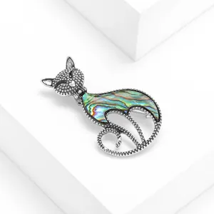Vintage cat brooch with iridescent abalone shell inlay and antique silver finish