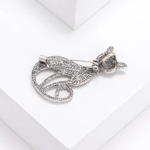 Vintage silver cat brooch with abalone shell texture shown from the back view