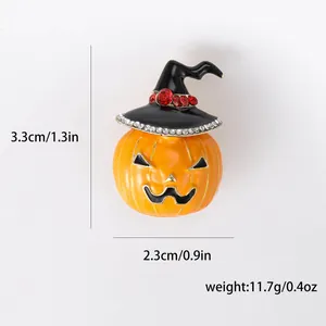 Halloween pumpkin jack-o'-lantern brooch with witch hat and rhinestone accents