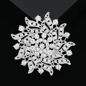 Exquisite hollow floral crystal brooch with silver base and sparkling rhinestones
