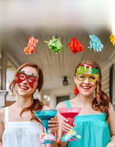 Women wearing chili and cactus themed Mexican party glasses for Cinco de Mayo celebration