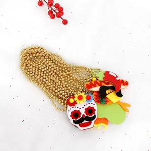 Mexican Fiesta beaded necklace with felt skull and sombrero charms on golden chain