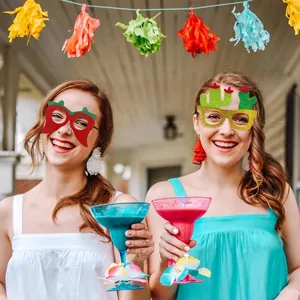 Two women wearing chili pepper and cactus glitter glasses for Mexican Fiesta party celebration