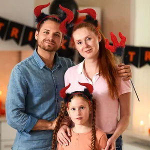 Family wearing red sequin devil horns and trident for Halloween party decoration