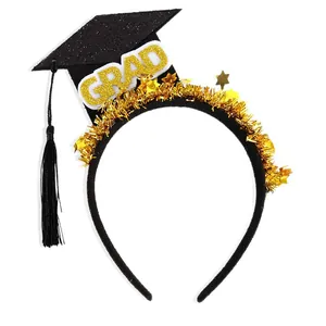 Black graduation headband with golden mini stars and shiny GRAD lettering for party