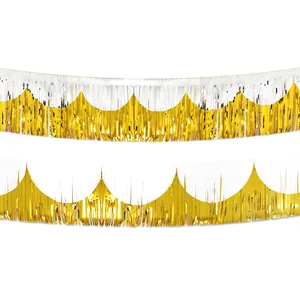 Close-up of gold and white metallic foil fringe curtains for party backdrop decoration