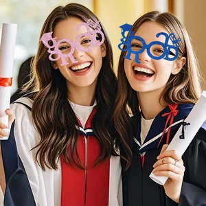 Female students wearing GRAD letter glasses in blue and pink for graduation photo props