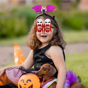 Kid wearing Halloween bat headband and vampire glasses set in a festive garden setting