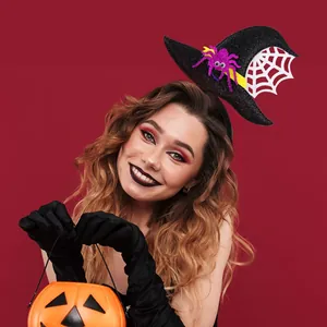 Detail of glittery witch hat headband with purple spider and white web for Halloween costume