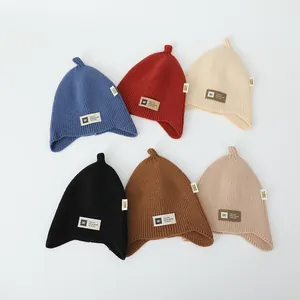 Winter knit baby earflap hats in six assorted colors with stylish letter patch