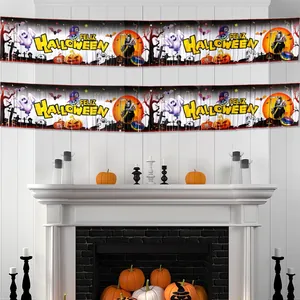 Spanish Feliz Halloween banner with ghosts and pumpkins hanging on a white fireplace