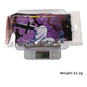 Detailed view of Halloween purple tinsel curtain in packaging weighing 32.2 grams