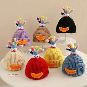 Detailed collection of colorful knitted snowman hats with cartoon eyes for children