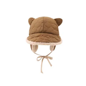 Winter children's plush aviator hat with bear ears and warm lamb wool lining in brown