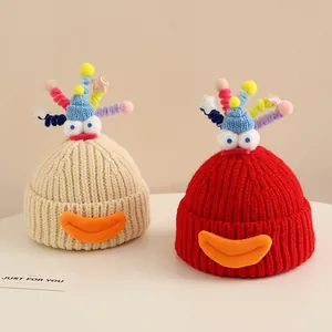 Cute knitted cartoon snowman hats for kids in cream and red with quirky monster features
