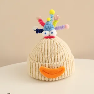Detailed close-up of a creative monster knit hat with colorful spirals and star sequins