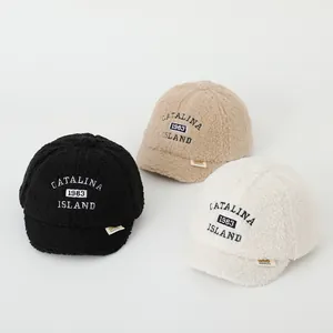 Winter fleece baseball cap for kids with embroidery in black, camel, and cream white