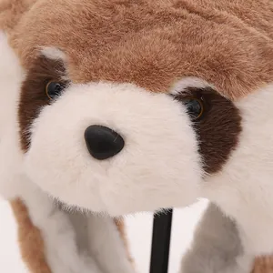 Close-up of plush raccoon winter hat showing high-quality faux fur and detailed animal face