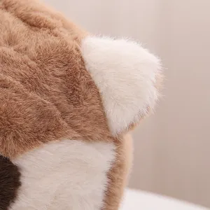 Detailed close-up of fluffy faux fur and ear design on winter raccoon trapper hat