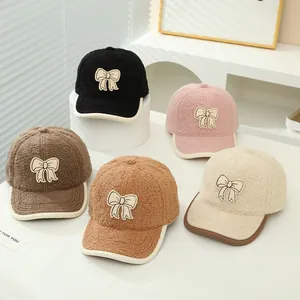 Detailed view of winter lamb wool baseball caps with bow patches in five assorted colors