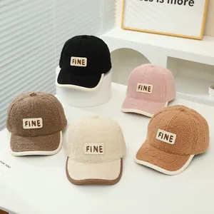 Detailed collection of five plush winter baseball caps featuring FINE embroidery patches