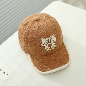 Cute brown sherpa baseball cap for girls with white bow embroidery and edged brim